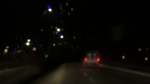 Blurred Ambulance Lights Racing Through Rain at Night Stock Footage 332482045