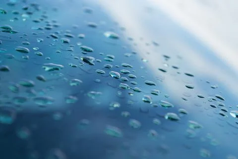 Blurred and focus of rain drop on glass window in monsoon season with blurred Stock Photos