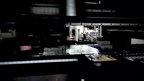 Blurred and selective focus of SMT machine mounting part in factory 動画素材 86888099