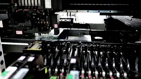 Blurred and selective focus of SMT machine mounting part in factory 動画素材 86888106