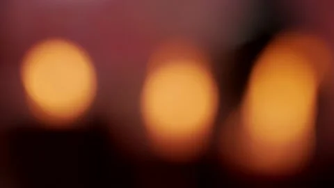 Blurred and unfocused three burning candles inside Chinese temple Stock Footage 134174358