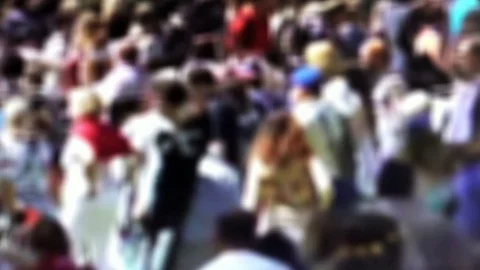 Blurred anonymous crowd of people walking on city street at different side Stock Footage 104229688