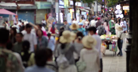 Blurred anonymous crowd walking on pedestrian street at Kunming downtown Stock Footage 329623634