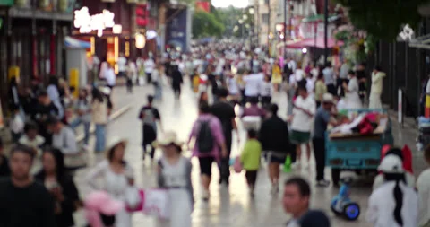 Blurred anonymous crowd walking on pedestrian street in Kunming, China Video stock 329624367