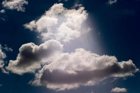 Blurred artistic background. A stream of light against a blue sky and white Stock Photos