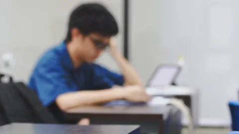 Blurred Asian students using phone during the class Stock-Footage 107614097
