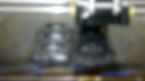 Blurred background. 3d printer create black detail close-up. 库存影片 138018625