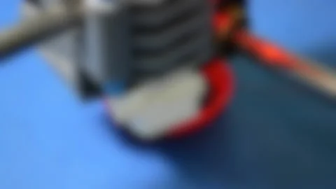 Blurred background. 3D printer in operation close-up. 動画素材 138018942