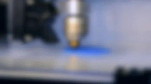Blurred background. 3d printer printing isolated blue object close-up Stock Footage 134907000
