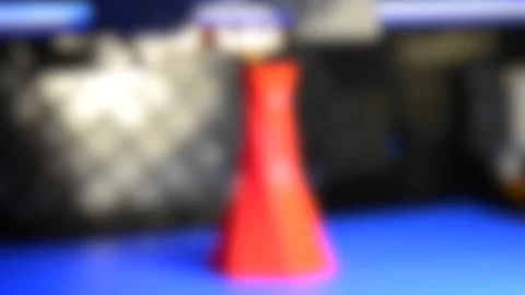 Blurred background. 3D printer printing isolated volume triangular object red Stock Footage 137672953