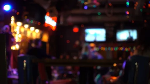 Blurred Background Backdrop Bar Pub Patio At Night With People Singing Danci Stock Footage 128152077