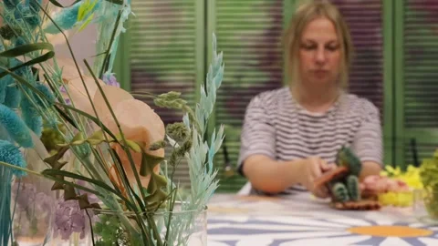 Blurred background, background, blonde designer chooses color palette and brushe Stock Footage 277795919