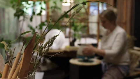 Blurred background, background, blonde designer chooses color palette and brushe Stock Footage 277907902