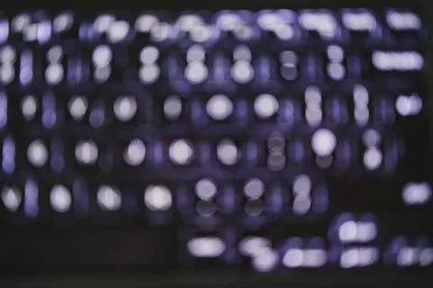 Blurred background of backlit keyboard with led light Stock Photos