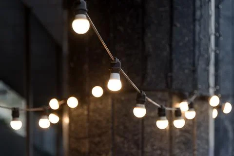 Blurred background, backyard illumination, light in the evening garden, elect Stock Photos