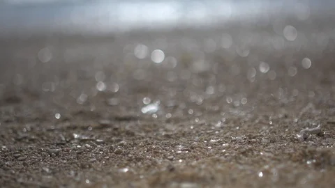 Blurred background of beach water sand with glittering sparkling bokeh Video stock 100169596