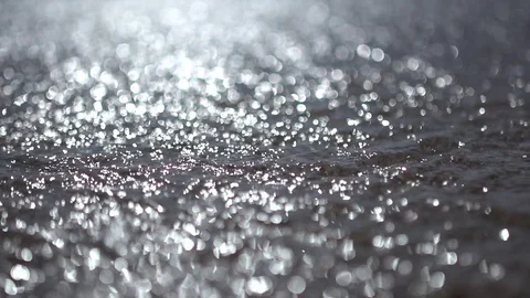 Blurred background of beach water sand with glittering sparkling bokeh Stock Footage 100170876