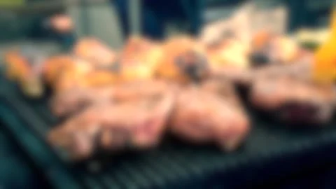 Blurred background. Big beautiful cuts of meat grilled on the barbecue Stock Footage 137669417