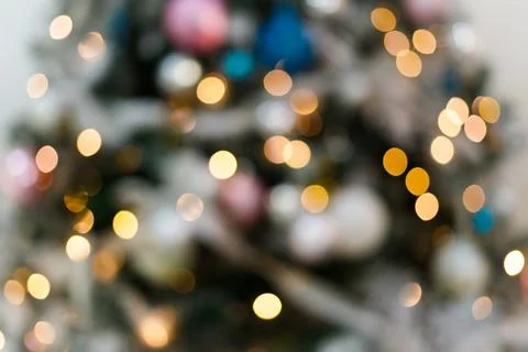 Blurred background with blinking lights of christmas tree Stock Photos