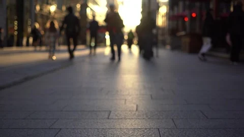 Blurred background. Blurred people walking through a city street Stock Footage 255850372