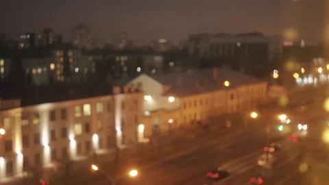 Blurred background of buildings with glowing windows against the evening sky and 库存影片 172243933