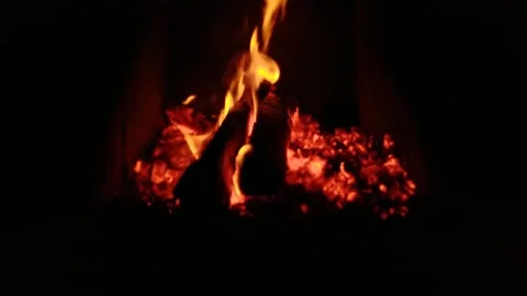 With a blurred background of burning 3 firewood in a stove Stock Footage 168768111
