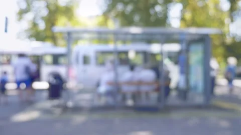 Blurred background. bus stop with people in the city on a summer day Video stock 138225910