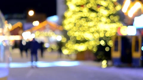 Blurred background. Christmas tree, decorated glowing lights, building, Stock Footage 197574812