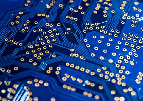 Blurred background of the circuit Board in blue macro photo. Stock Photos