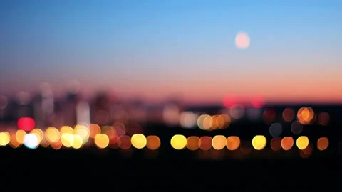Blurred background of city at sunset with the moon in the sky 库存影片 160824385