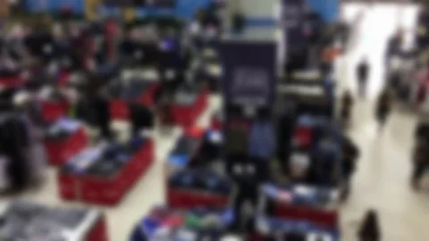Blurred Background of Clothes Fair with People Walking and Shopping Stock Footage 84839436