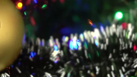 Blurred background . The colored lights of the garland are blinking on the Stock Footage 144347023