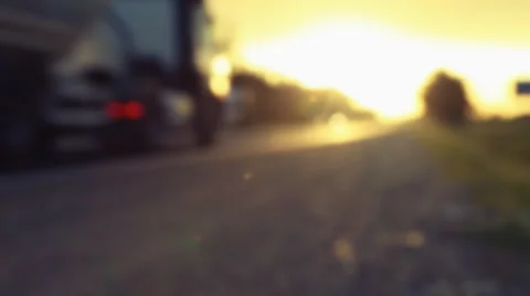 Blurred background of coutry road with traffic at sunset. Stock Footage 64528369