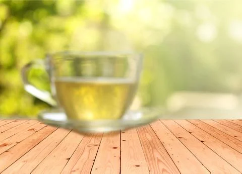 Blurred background : Cup of tea on a blurred background of nature with burst  Stock Photos