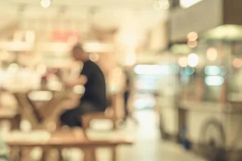 Blurred background of customer sitting in coffee shop or cafe restaurant with Stock Photos