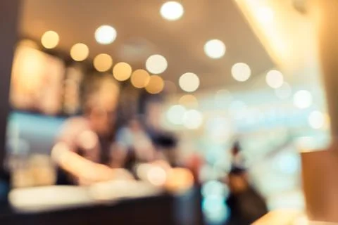 Blurred background of customer sitting in coffee shop or cafe restaurant with Stock Photos