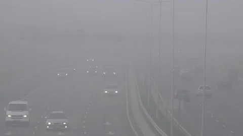 Blurred background of dense autumn fog on city highway road. 4K Stock Footage 59557694
