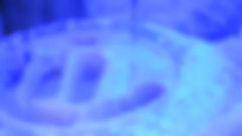 Blurred background. Dental milling machine carving out shape of human teeth Stock Footage 135982959