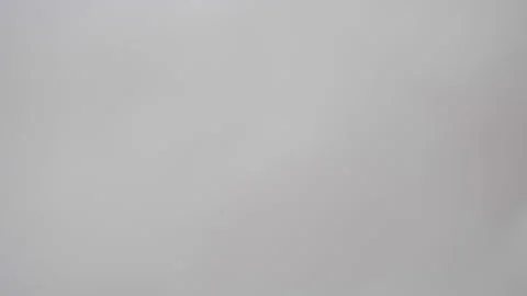 Blurred background. Dripping green colored drops on white background. Stock Footage 138319986