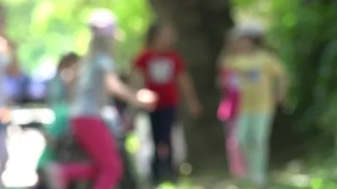 Blurred Background effect With Group Of Kids Playing Outside Vidéo 194496980