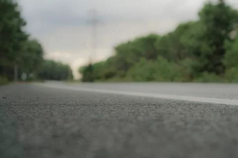 Blurred background with an empty asphalt road Stock Photos