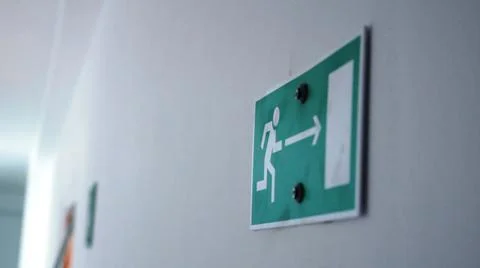 Blurred background of evacuation directions to corridor Stock Photos