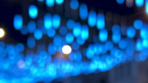 Blurred background with falling blue bokeh lights for social media template 動画素材 340428027