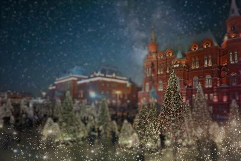 Blurred background with festive Christmas lights on Red Square in Moscow. Stock Photos