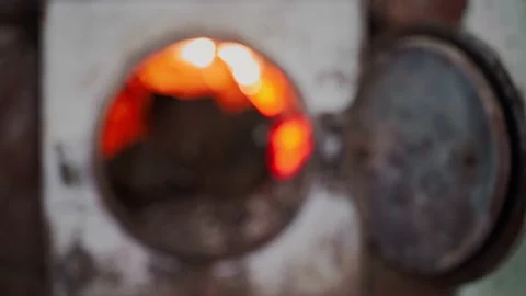 Blurred background of a fire burning in a rural stove for heating a house. Space Stock Footage 218563731