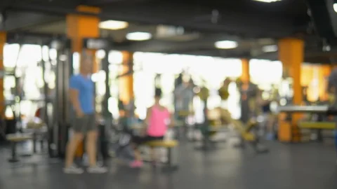 Blurred background, general plan of the gym. athletes do traction of the upper Stock Footage 114990306