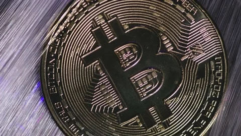 Blurred background. Golden bitcoin close-up Stock Footage 151735772