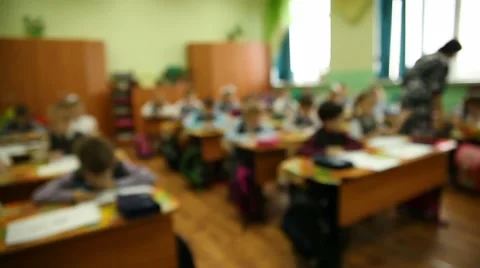 Blurred background group of kids in a classroom at a school desk is a lesson in 스톡 동영상 56985954