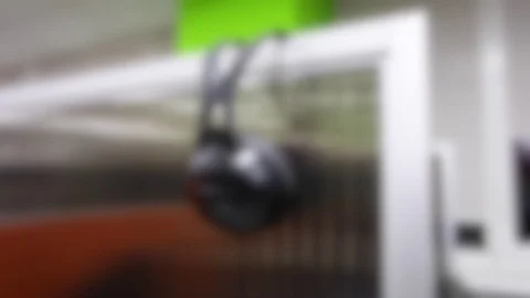 Blurred background, headphones on the partition Stock Footage 83732234