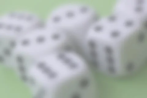 Blurred background image of dice game with dice cup on green table casino con Stock Photos